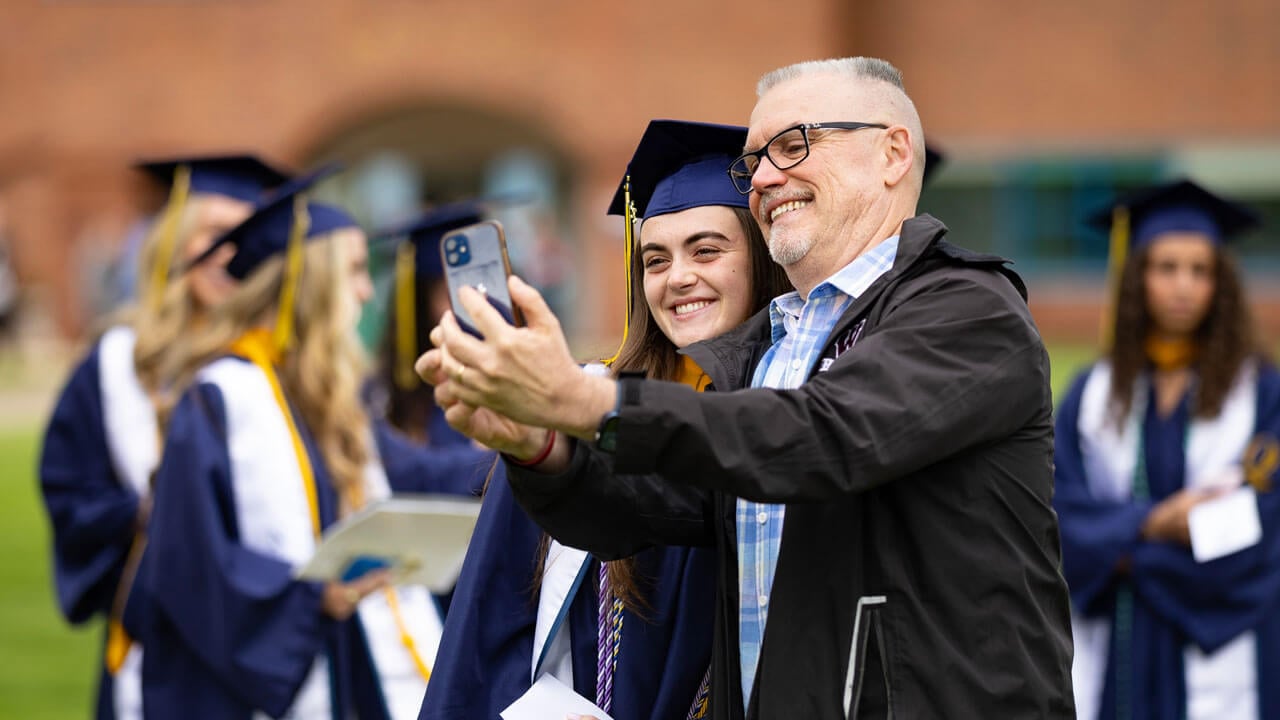 Graduate takes selfie with loved one