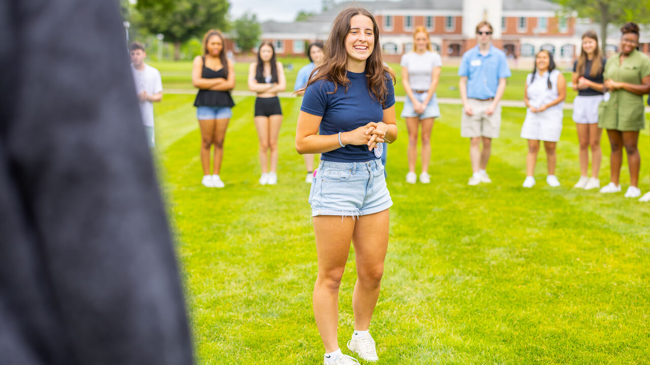 Individuals standing on the Quad during Orientation