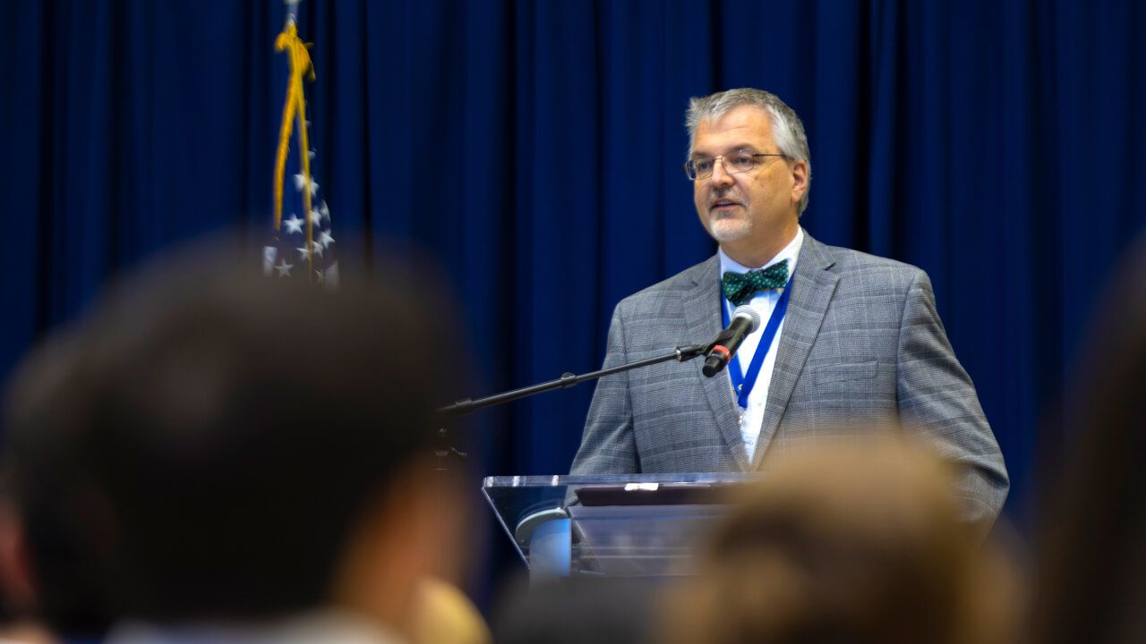 Person speaks at a podium